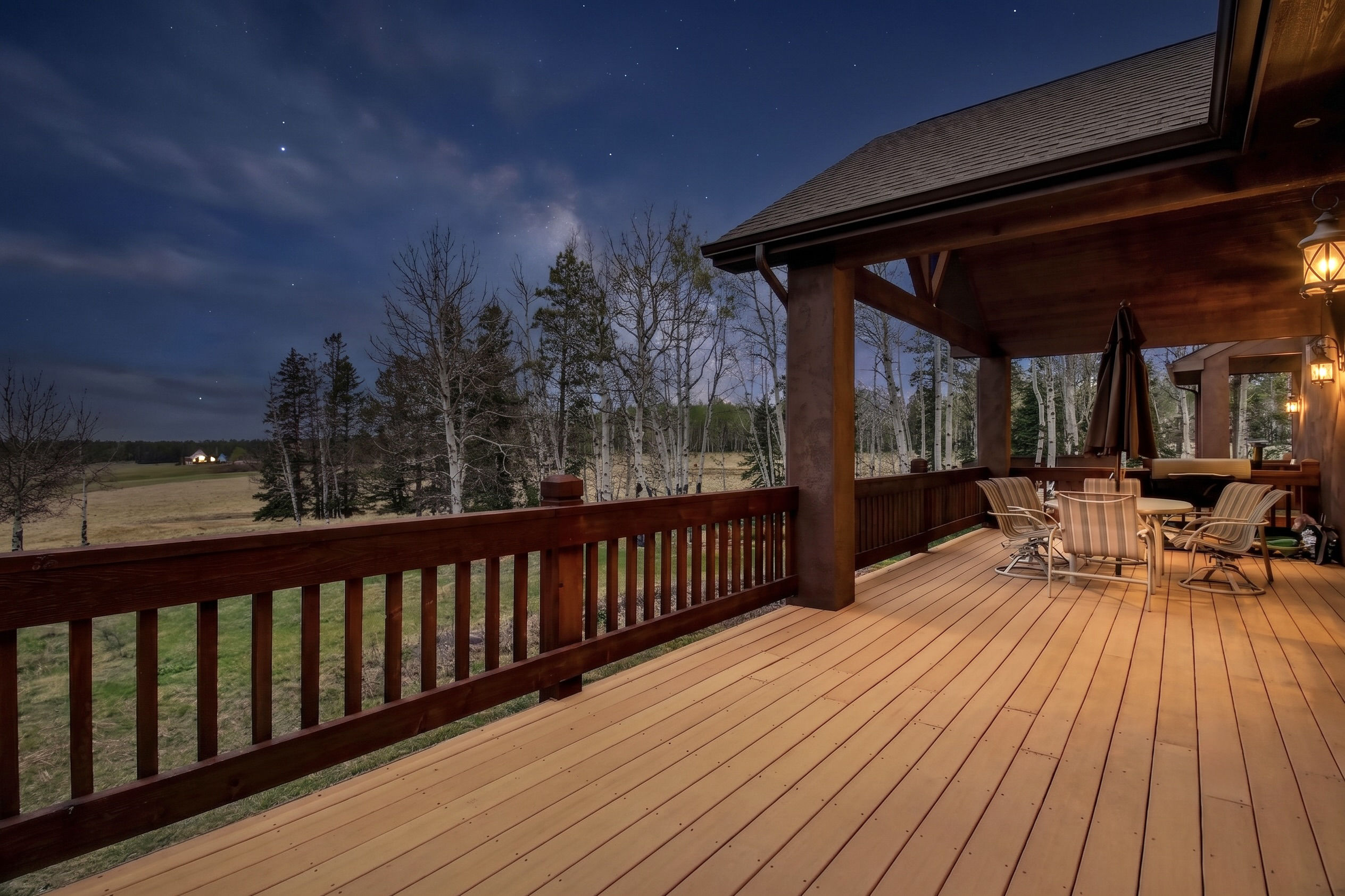 Covered deck overlooking the meadow and mountains